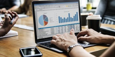 Business people working on a laptop in a meeting Business people working on a laptop in a meeting