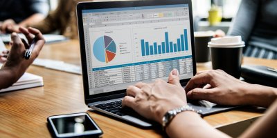 Business people working on a laptop in a meeting