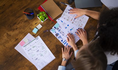 top-view-women-working-together-office